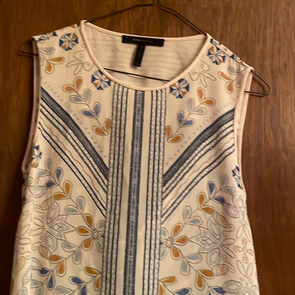 chairs sleeveless shirt